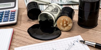 barrel of oli, dollar, bitcoin, calculator and pen