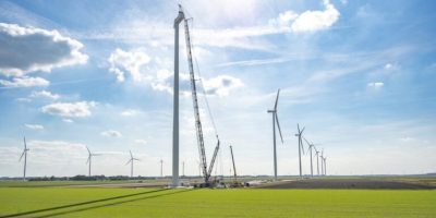 Wind turbine construction with huge cranes at a new wind park in Flevoland, Netherlands.